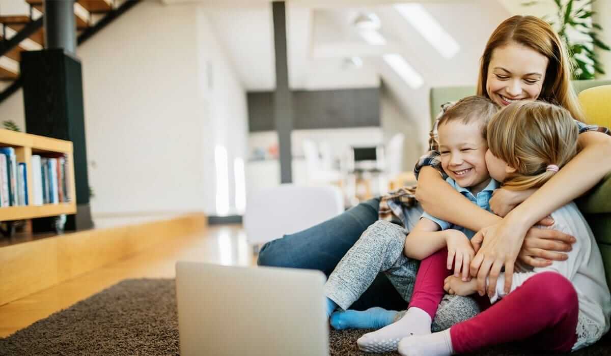 Mother and two laughing children