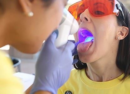 Patient receiving oral cancer screening