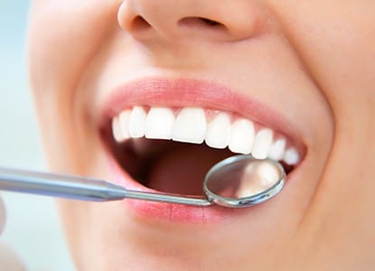 Closeup of patient receiving tooth-colored fillings