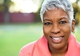 Older woman outdoors smiling